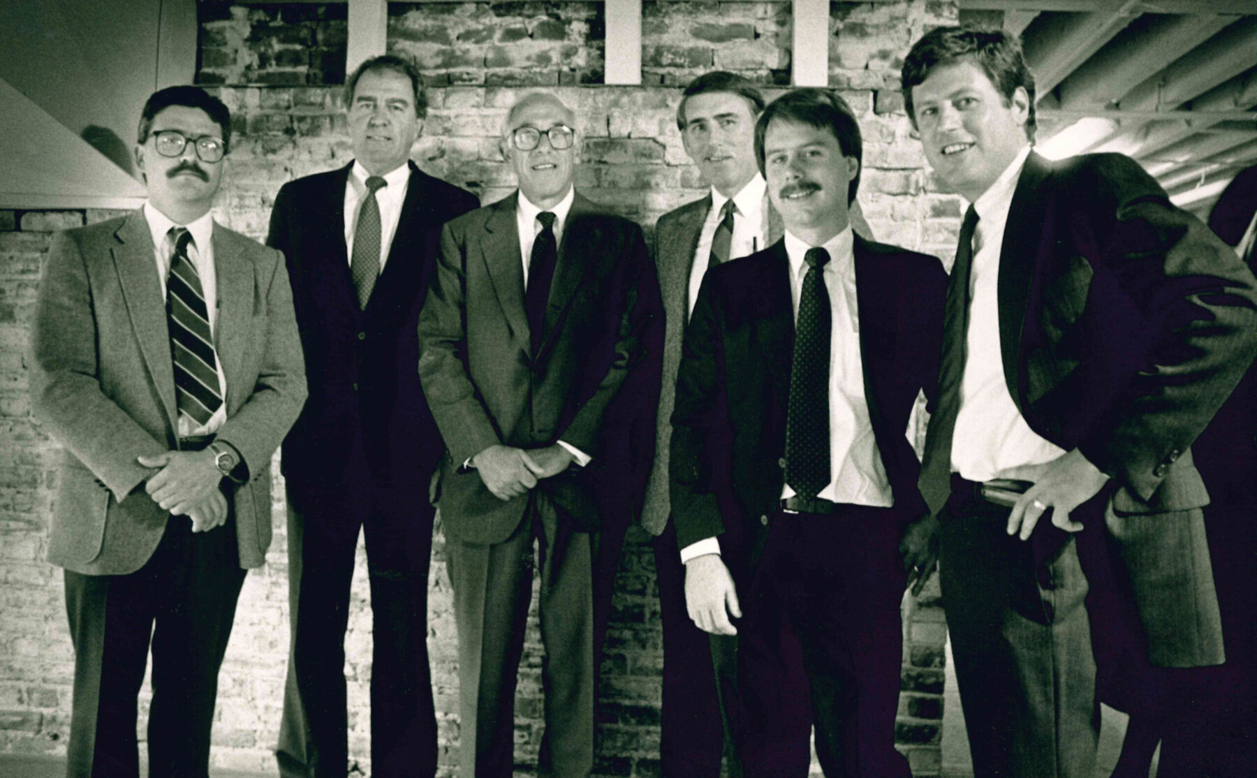 A black and white group photo of early founders